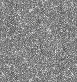 a black and white photo of a glittery surface