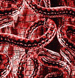 a red and black photo of a snake