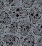 a lot of skulls that are on a gray background