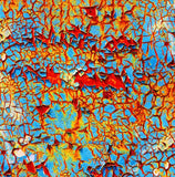 a close up of a blue and yellow wall