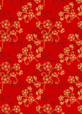 a red background with gold flowers on it