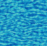 a blue water surface with waves and ripples