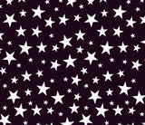 a pattern of white stars on a black background