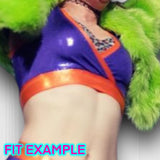 a woman in a purple top and green furry coat