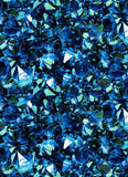 a large group of blue crystals sitting on top of a table