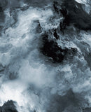 a black and white photo of clouds and water