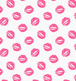 a white background with pink lipstick prints on it